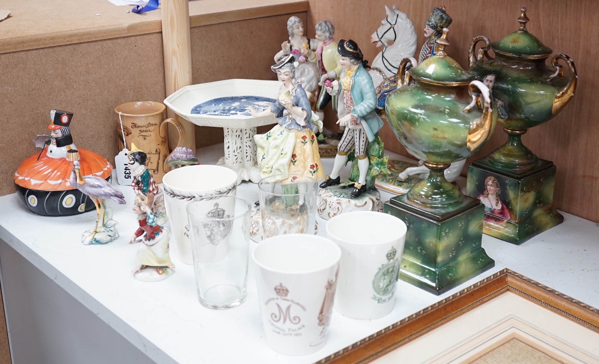 A group of porcelain figures, Doulton royal commemoratives, a Goebel Art Deco powder bowl and pin dollies etc (19)